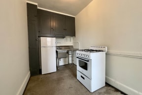 a kitchen with a stove and a refrigerator