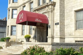 a red awning in front of a building
