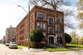 a red brick building on the corner of a city street