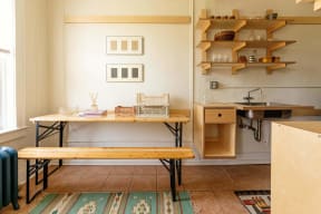 a small kitchen with a table and a sink