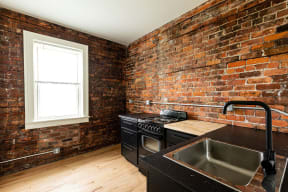 a restaurant with brick walls and a table and chairs