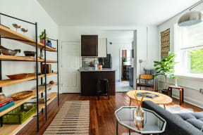 a living room with a kitchen and a table