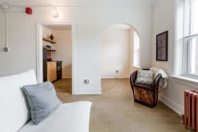 a living room with a couch and a chair