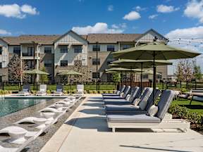 A row of sun loungers outside of our resort-style pool