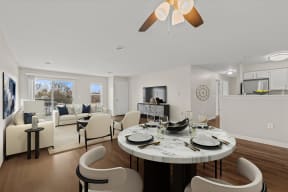 an open living room and dining room with a table and chairs