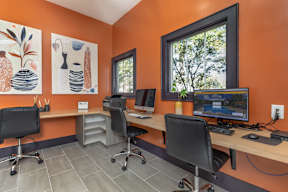 business center with computers and printer