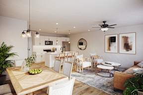 A modern living room with a dining table and chairs.