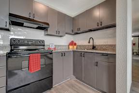 a kitchen with stainless steel appliances and granite counter tops