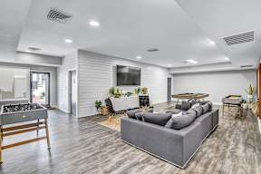 the reserve at bucklin hill clubhouse resident lounge with couches and a ping pong table