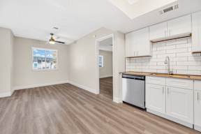 a kitchen and living room in a 555 waverly unit