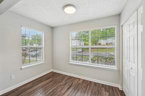 A room with a window and a door.