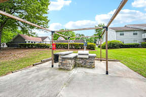 A playground with a swing set and a red flag.