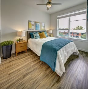 bedroom with green and white comforter at Brixton South Shore, Austin, 78741