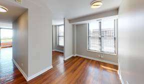 A room with wooden floors and white walls.