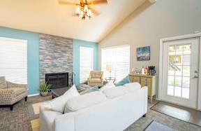 a living room with a couch and a fireplace