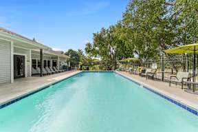 A long rectangular pool with a blue tiled edge.