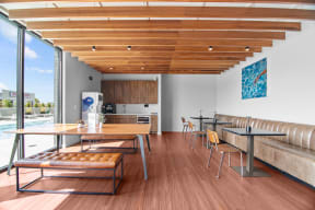 a dining room with wooden floors and a table and chairs
