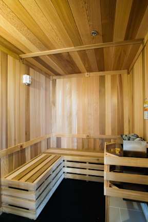 A sauna with wooden benches and walls.
