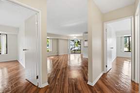 A room with wooden floors and white walls.