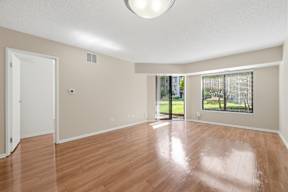 A room with wooden floors and a white ceiling.