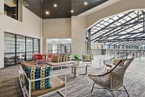 A large room with a lot of chairs and tables.