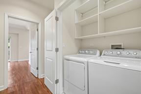 A laundry room with a washer and dryer.