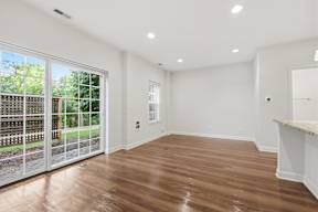 A room with wooden floors and white walls.