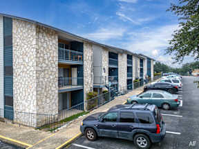 a building with cars parked in front of it