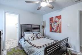 the preserve at ballantyne commons bedroom with bed and ceiling fan