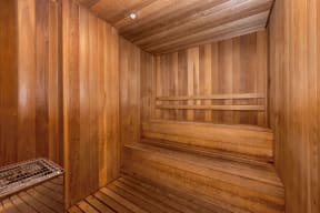 a sauna in a wooden room with a bench
