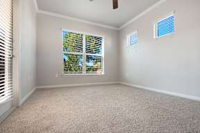 a bedroom with a large window