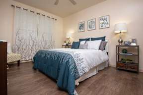 guest bedroom with blue comforter