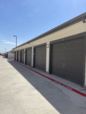a row of garage doors on the side of a building