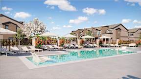 A large swimming pool surrounded by lounge chairs and umbrellas in front of a building.