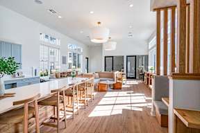 a communal area with tables and chairs