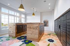 a large wooden chest of drawers in a white room with a colorful rug on the floor