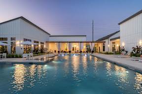 a house with a swimming pool in front of it