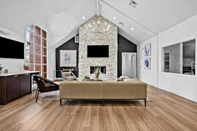 a living room with a couch and a fireplace