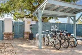a group of bikes parked under a shed