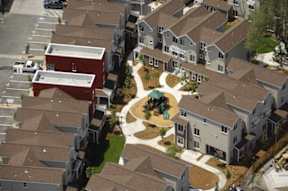 A bird's eye view of a neighborhood with houses and a central courtyard.