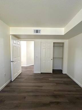 A room with two doors and a window.