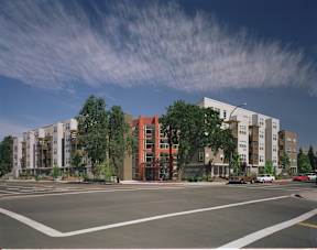 A street view of a residential area with apartment buildings.