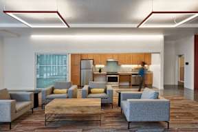 A person is walking in a modern living room.