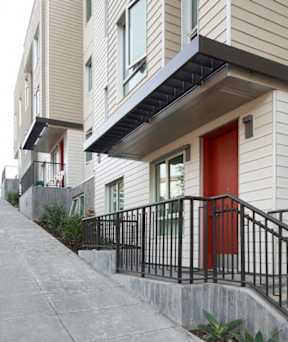 A row of houses with a red door.