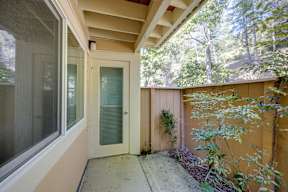 A patio with a door and a window.
