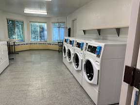 A row of washing machines in a laundromat.