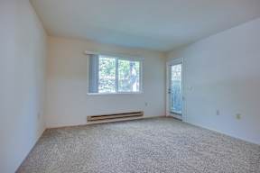 A room with a window and a door.