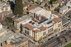 A large building with a lot of windows is in the center of the image.
