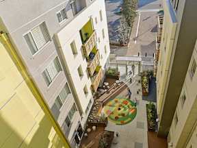 A courtyard with a circular design in the middle of it.