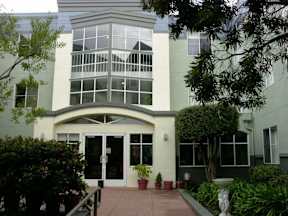 A building with a glass window and a white door.